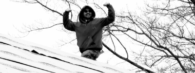 image of man on roof
